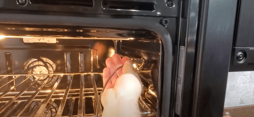 Checking oven temperature 